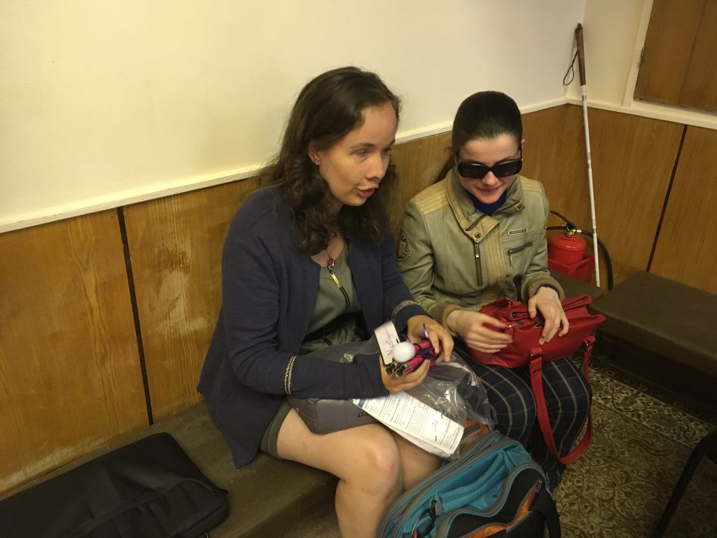 Laurel presents a cane to a woman from Moscow.