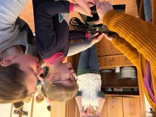 Laurel presents a young female student with a new laptop computerr.